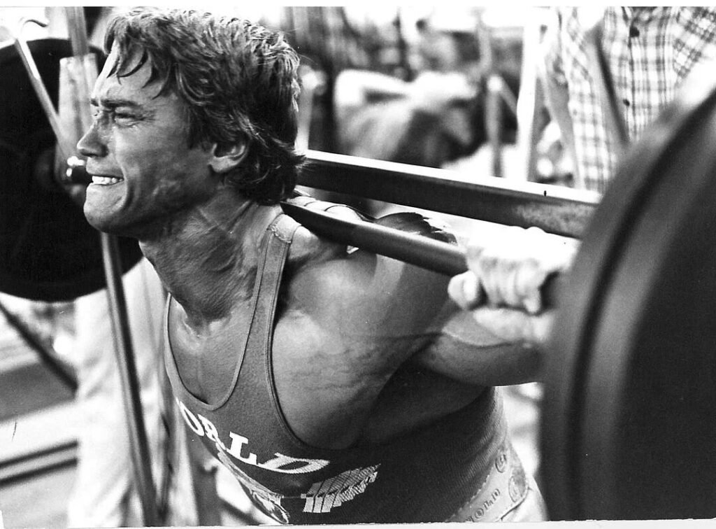 arnold schwarzenegger lifting weights